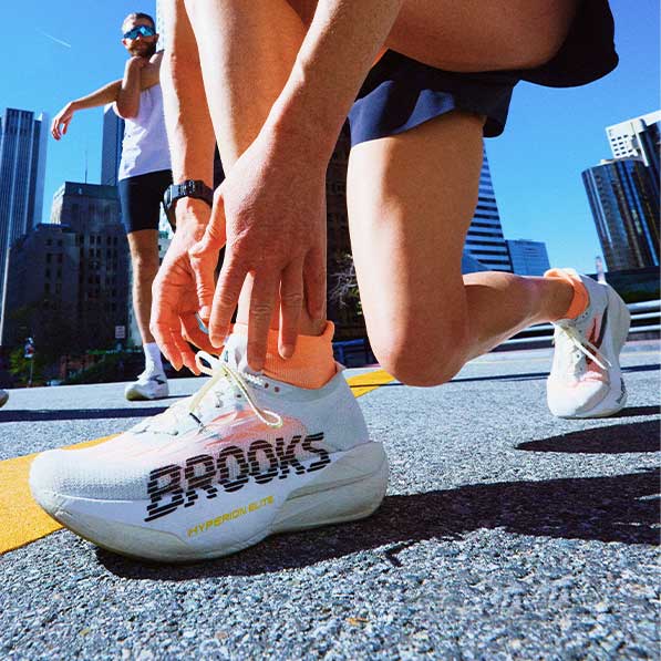 A closeup of a woman wearing Brooks shoes