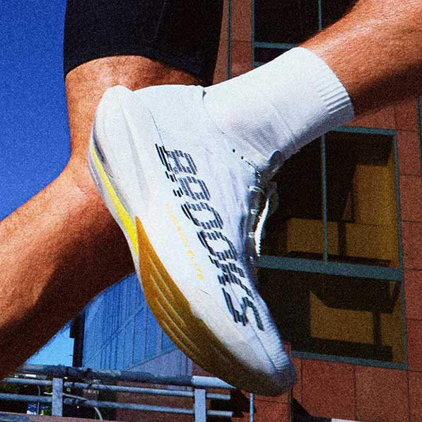 A closeup of a man wearing Brooks shoes